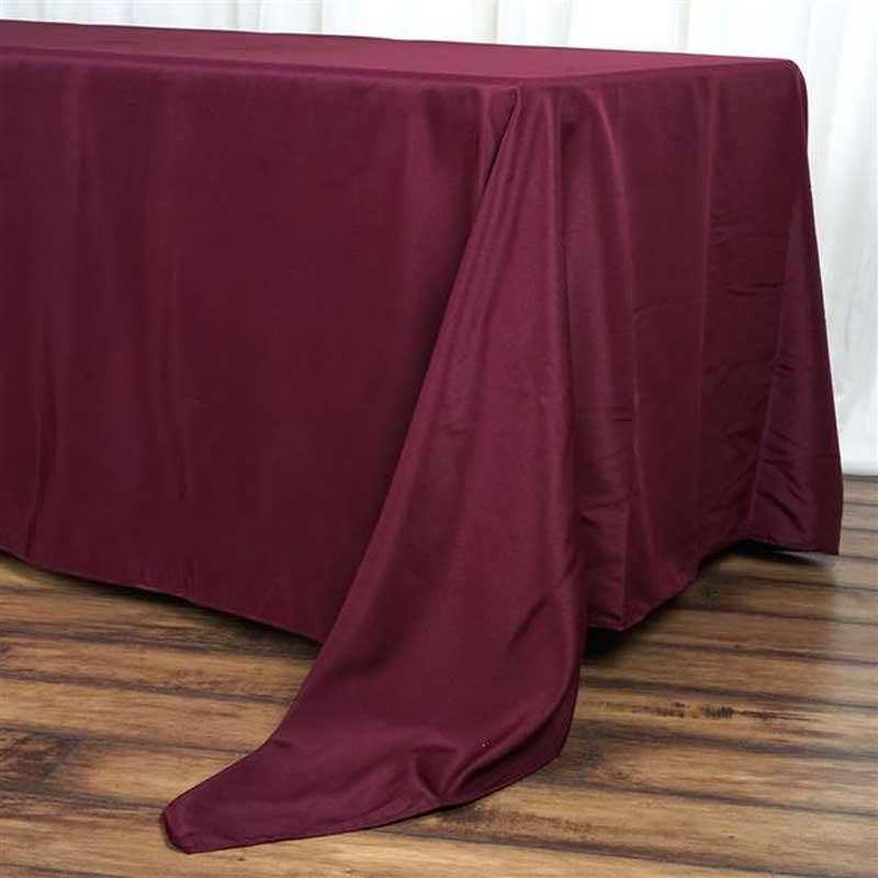 Burgundy tablecloth draped over a rectangular table