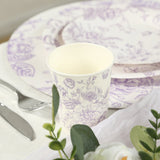 Floral-patterned paper cup with matching plates, set on a table.