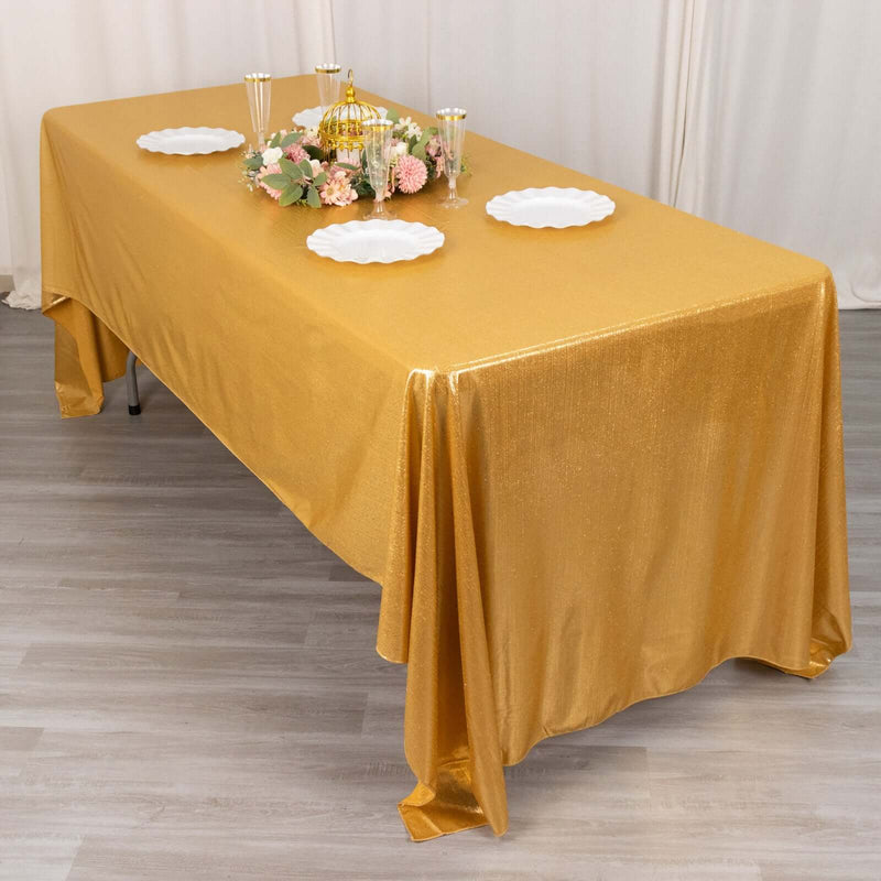 Gold rectangular tablecloth on a decorated banquet table