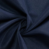 Navy tablecloth draped over a folding table #whtbkgd