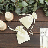 Elegant satin favor bags tied with bows, ideal for weddings and events.