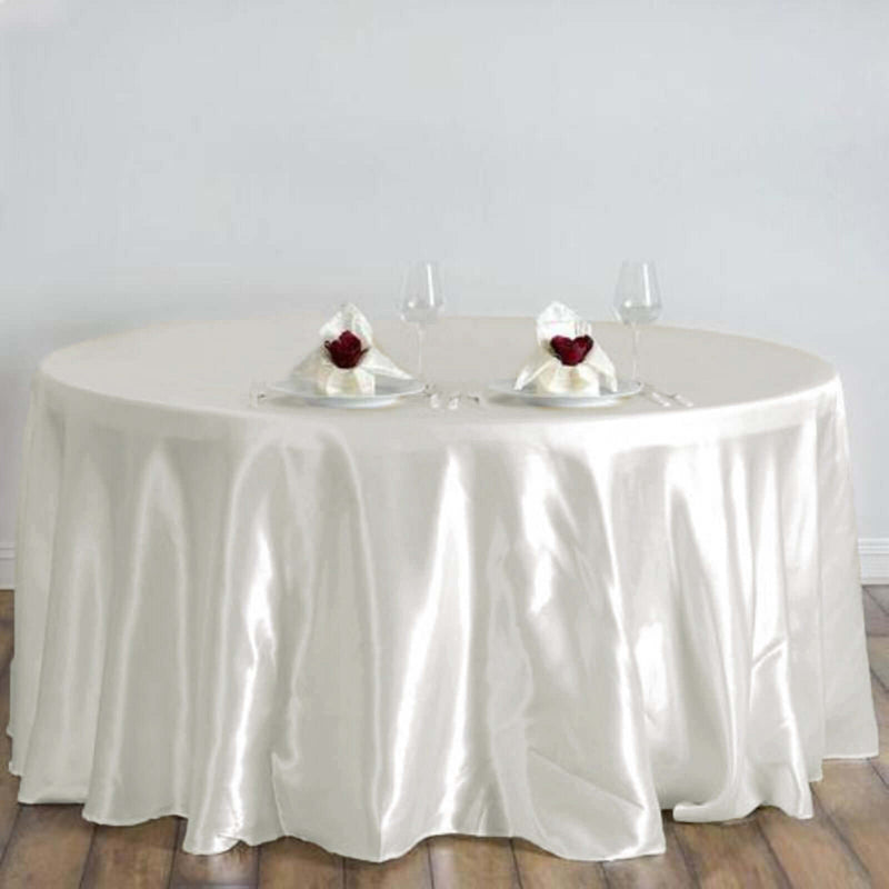 White round satin tablecloth with floral centerpiece