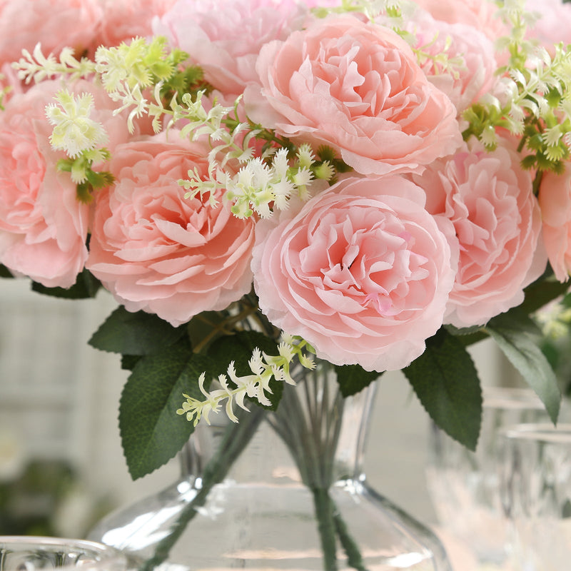 Pink silk peonies in a glass vase