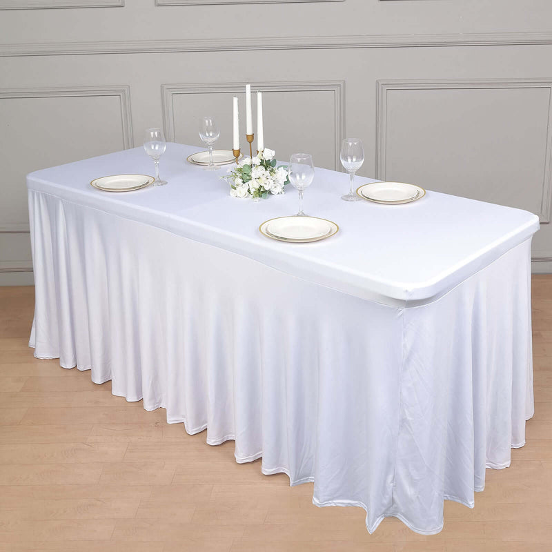 White tablecloth with wavy drape on a rectangular table
