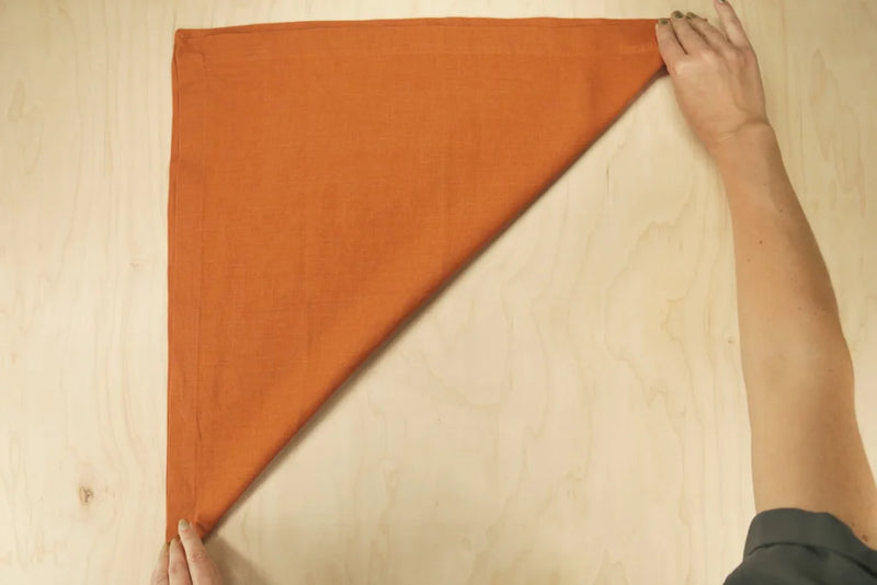 Envelope-style napkin fold on a table setting