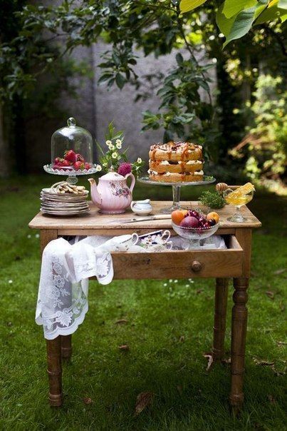 Outdoor dessert table with Easter decor and cake stand