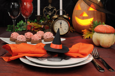 Halloween place setting with pumpkin and witch hat