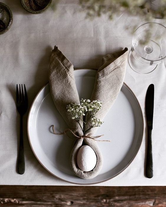 Bunny ear napkin fold with an egg place setting
