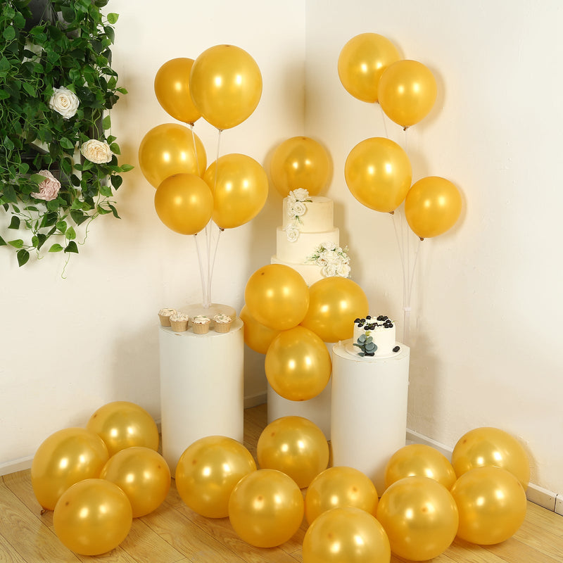 Gold balloons with party display and cake stands