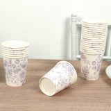 Floral patterned disposable cups stacked on a wooden table.