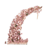 Pink floral arrangement in a unique curved design on a white background.