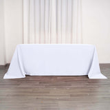 90"x132" White Polyester Rectangular Tablecloth