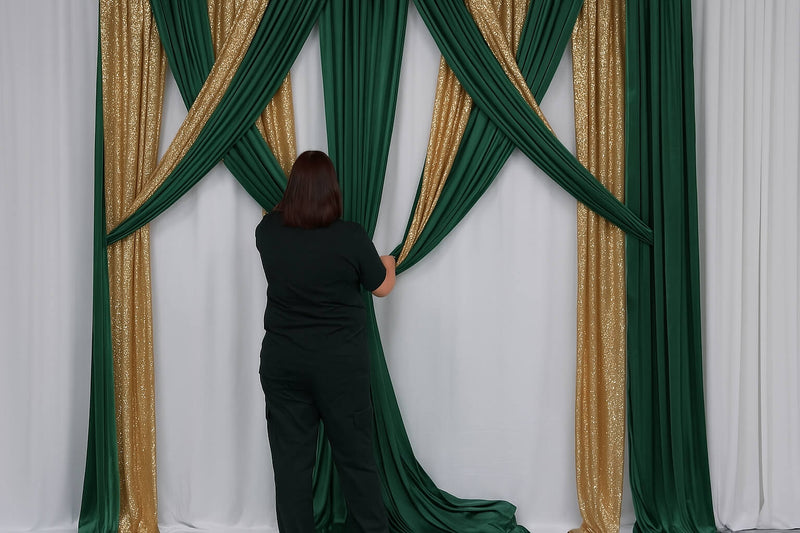 Styling backdrop drapes to complement green and gold table decor theme.
