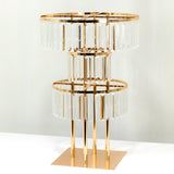 Elegant crystal and gold table lamp with multiple tiers.
