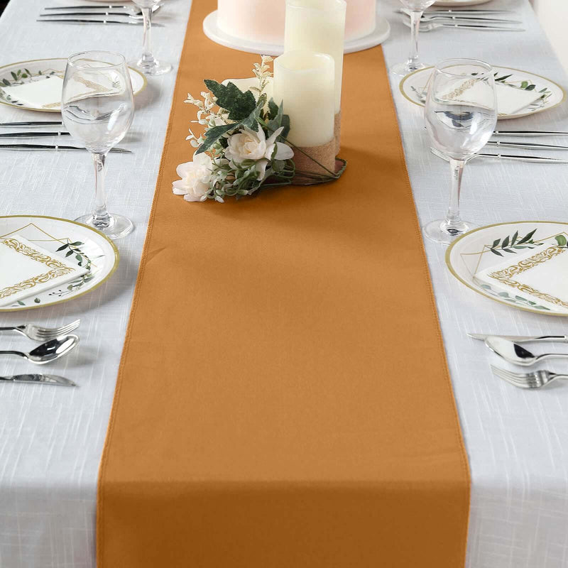 Gold table runner on a set dining table
