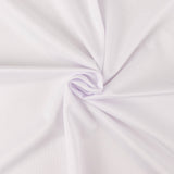 White tablecloth draping elegantly over a table with a floral centerpiece. #whtbkgd