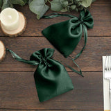 Green satin drawstring bags for gifts or favors.