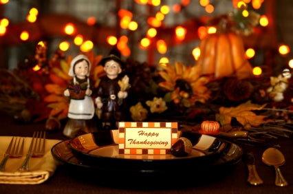Thanksgiving table setting with candles and autumn decor