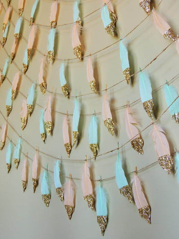Pastel feathers with gold tips on strings