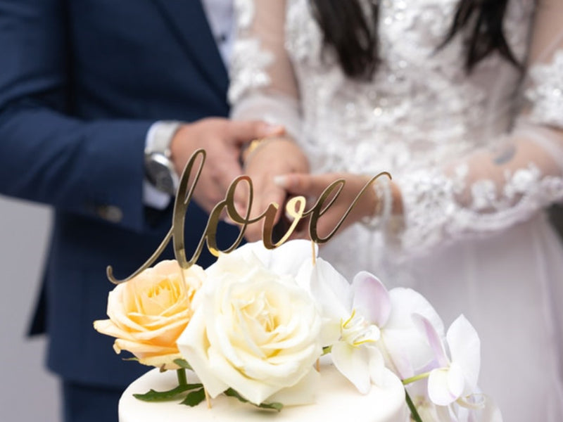 Wedding cake topper with roses and orchids