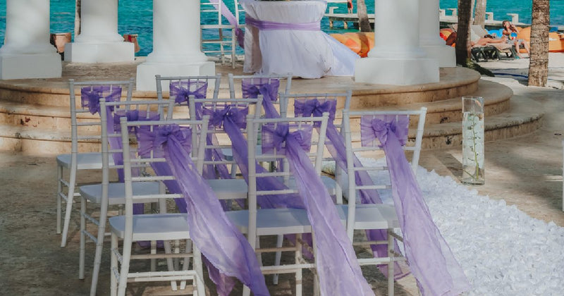 Blue chair sashes tied on banquet chairs