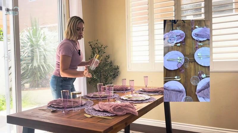 Woman placing glasses on lavender table setting with purple accents and gold flatware.