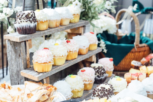 Cupcakes displayed on a rustic wooden stand