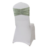 White chair cover with green ruched sash, studio-style isolation shot.