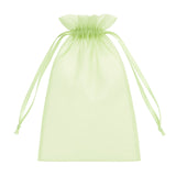 Light green organza drawstring bag on a white background #whtbkgd