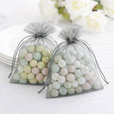 Pastel-colored candy-filled organza bags for party favors