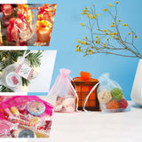 Gift bags with candles, ornaments and candy for holiday and Christmas gifting