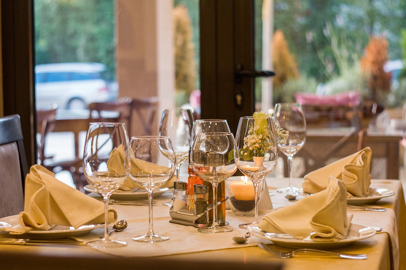 Table setting with folded yellow napkins