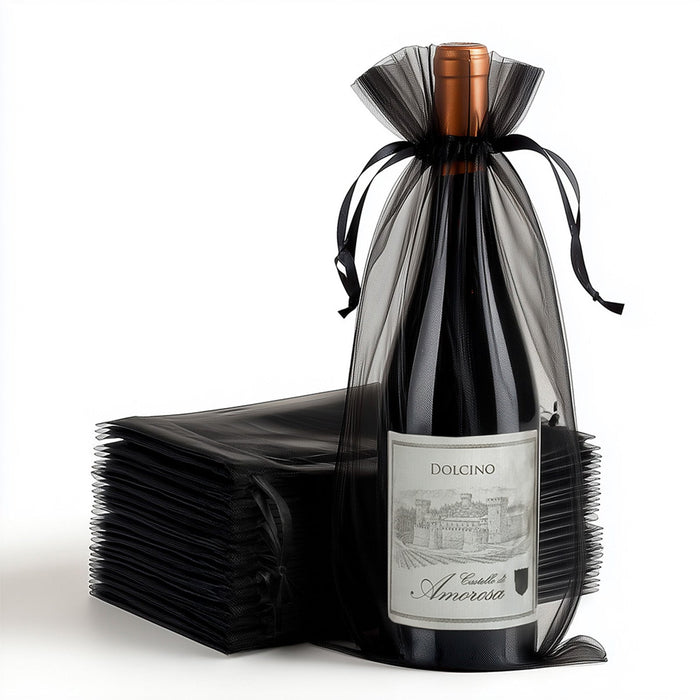Dolcino wine bottle wrapped in black tulle with a stacked backdrop