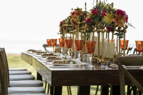 Tall gold flower stand with floral arrangement