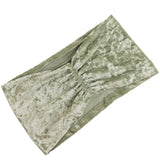 Green velvet headband with gathered design on a plain background #whtbkgd