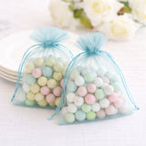 Pastel-colored candy-filled organza bags for celebrations