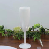 Pearl white shatterproof champagne flute with a sleek design for celebrations.