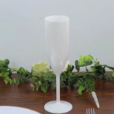 Pearl white shatterproof champagne flute with a sleek design for celebrations.