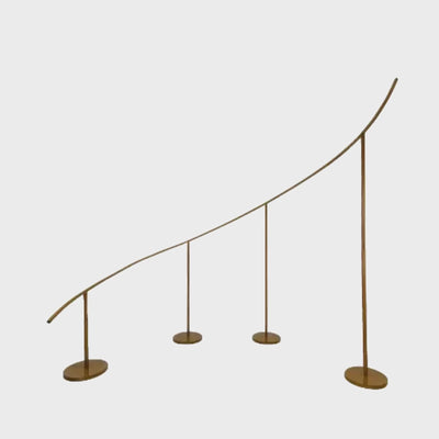 Gold curved wave wedding arch backdrop stand for balloon and floral décor.