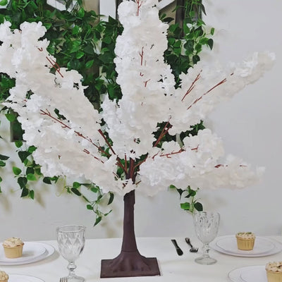 White silk cherry blossom tree centerpiece with a metal base.