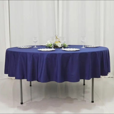 Navy blue fire retardant scuba tablecloth, 90" round, wrinkle-free and stain-resistant.