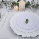 White plastic dessert plates with a reef design on an elegant table setting.