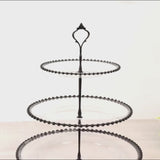 Clear 3-tier plastic dessert display stand with black beaded rim.