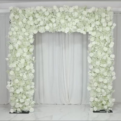 White artificial flower backdrop for wedding arch décor with silk roses and baby's breath.