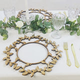 Gold charger plate with leaf design on a decorative table setting.