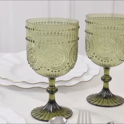Dusty sage green vintage plastic wine goblets with embossed floral pattern.