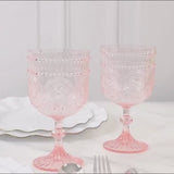 Blush embossed floral pattern wine goblets in a 12-pack, shatterproof and reusable.