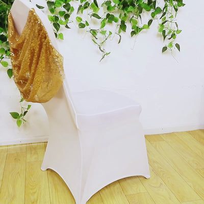 White spandex banquet chair cover with gold sequin swag back.