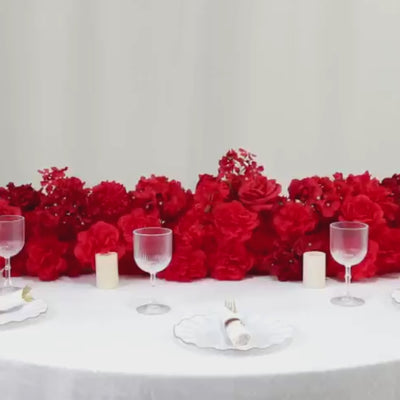 Mixed red silk flower table runner with roses, hydrangeas, and peonies.