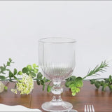 Clear vintage glass goblet with ball stem accent, 13oz capacity.